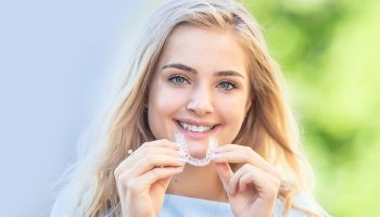 Is it better to go to a dentist or orthodontist for Invisalign?